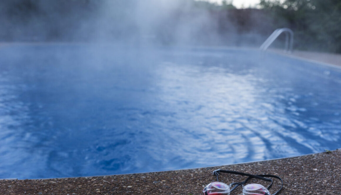 Swim goggles cast aside from an empty swimming pool