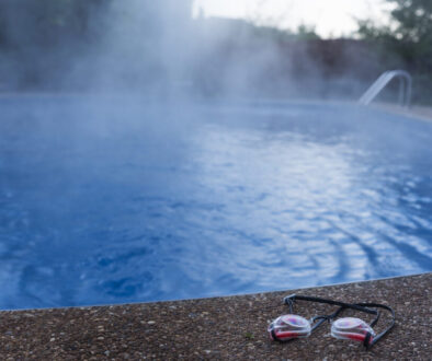 Swim goggles cast aside from an empty swimming pool