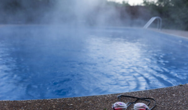 Swim goggles cast aside from an empty swimming pool